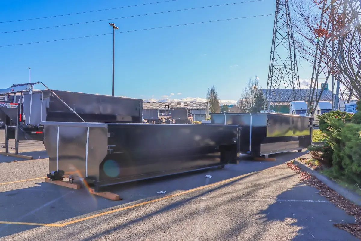 Roll-off dumpster ready for waste disposal at job site for Concrete Dumpster Rental in Brunswick